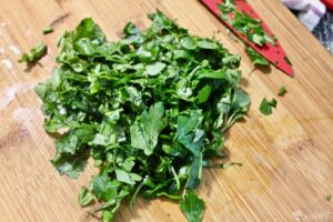 chopping parsley, basil and oregano