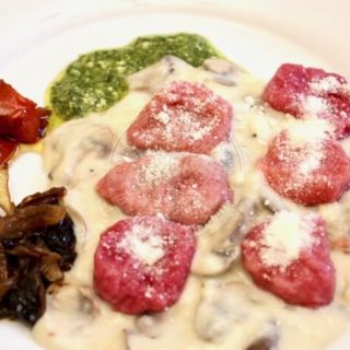 Beetroot gnocchi with truffle infused sauce