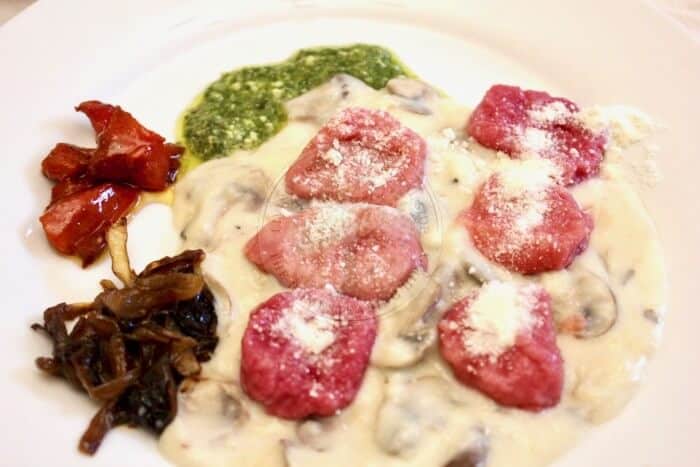 Beetroot gnocchi with truffle infused sauce