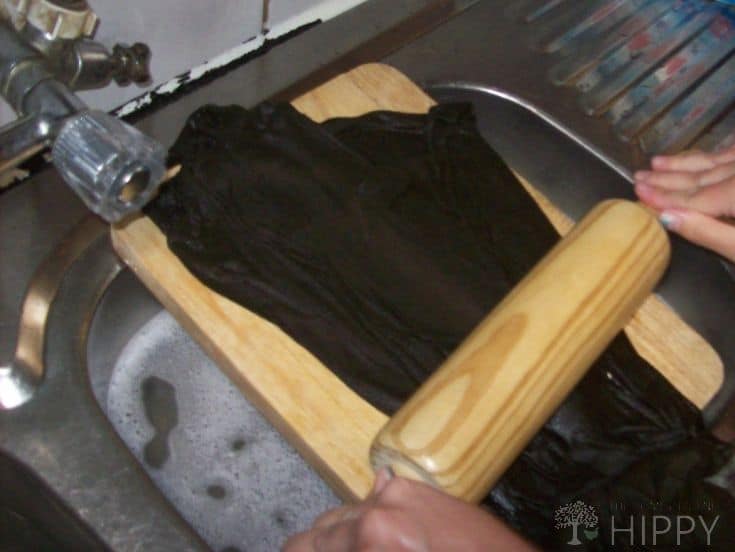 Use a rolling pin to remove water from your garment