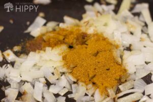 curry powder added to sauteed onions and garlic