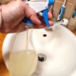 spray bottle with lemon juice and vinegar bathroom cleaner