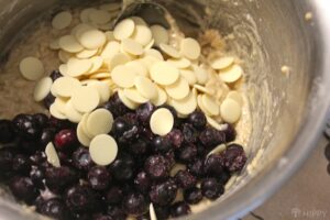 adding blueberries and white chocolate