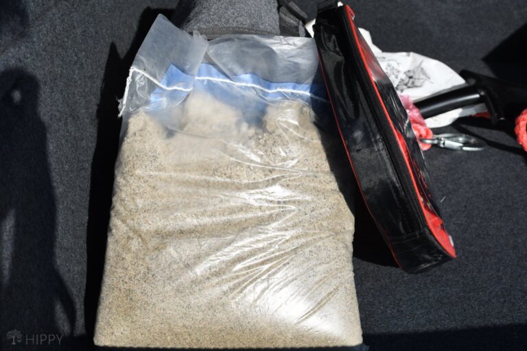 bag of sand in car trunk