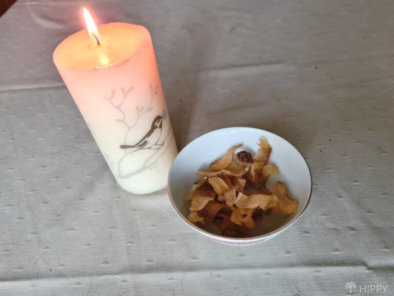 dehydrated canned pears in bowl next to lit candle
