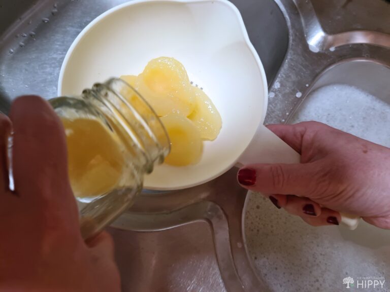 draining canned pears through strainer