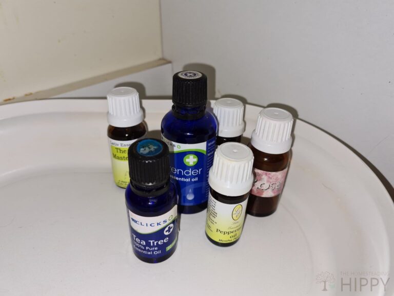 tea tree oil and other essential oils inside kitchen cabinet