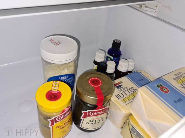 tea tree oil and other essential oils on fridge shelf