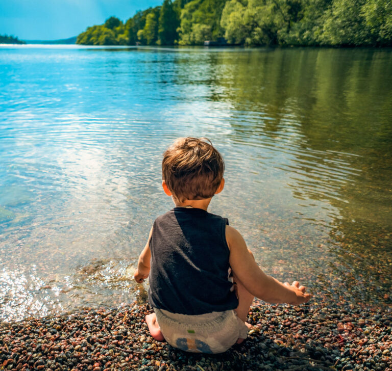 child near a lake