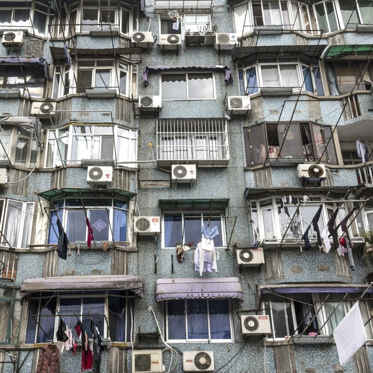 apartment building with AC units