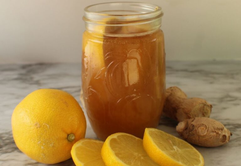 lemon-ginger honey next to ginger and orange