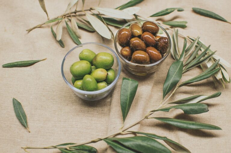 green and brown olives in two bowls