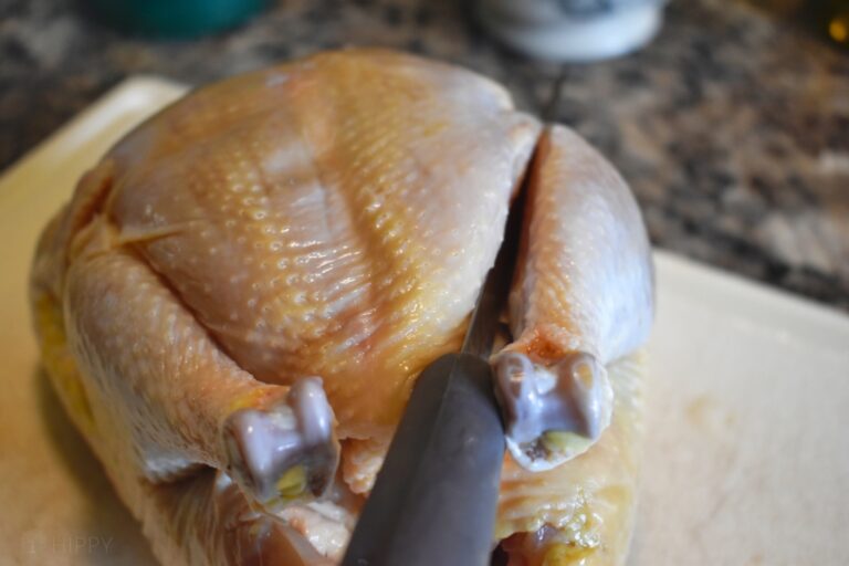 cutting the fat line on a whole chicken