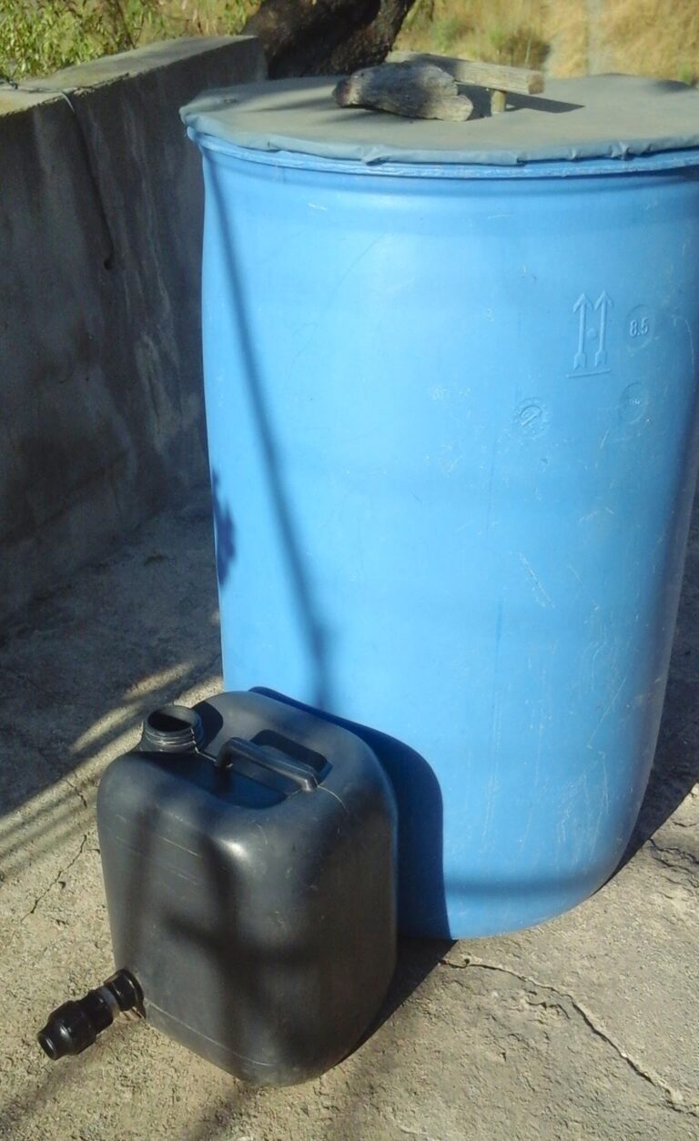 55-gallon drum next to re-purposed jerry can