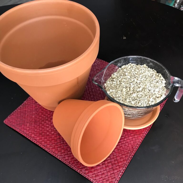 two clay pots and gravel