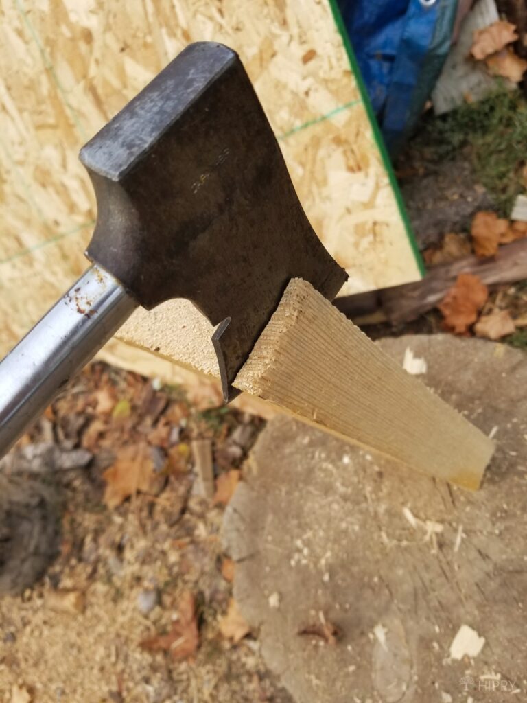 chipping kindling with hatchet