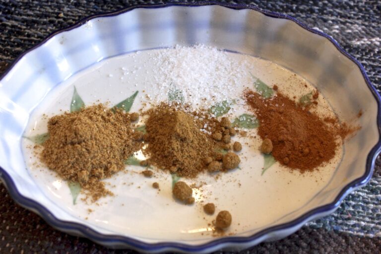 coriander, cumin, cinnamon, and salt on a plate