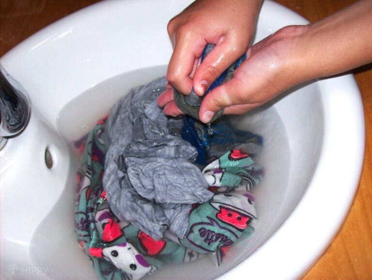 washing my clothes by hand in kitchen sink