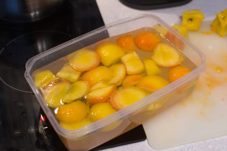 sliced peaches in sugar and ascorbic acid syrup in tupperware