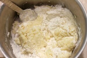 mashed potato with flour being added