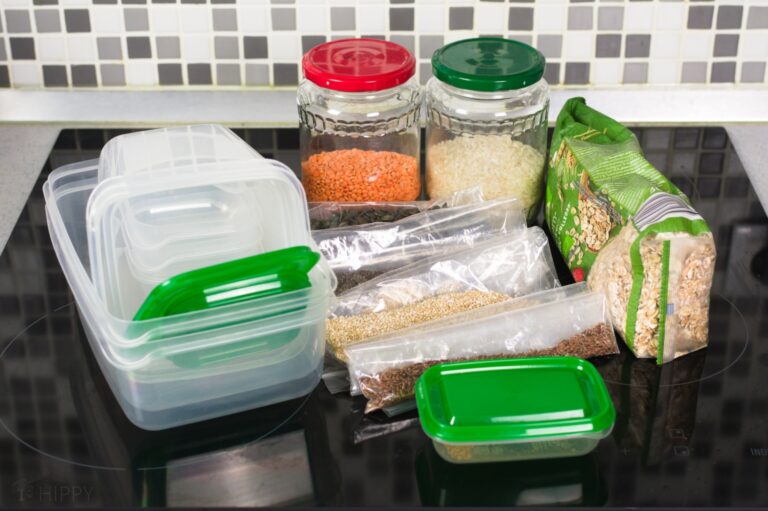 Tupperware containers and food in glass jars and zipper bags
