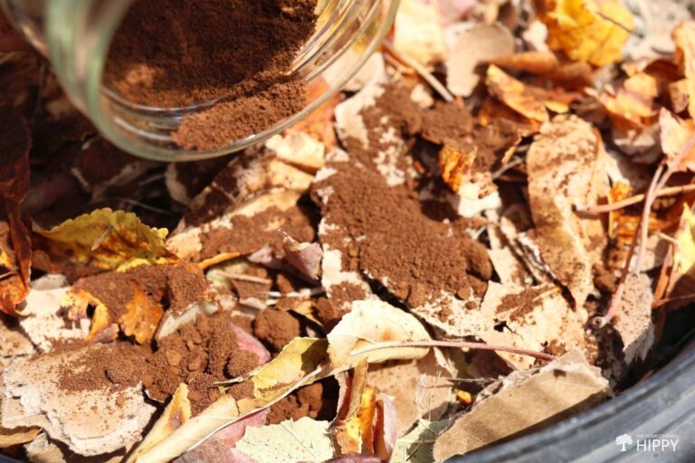 sprinkling coffee grounds over compost