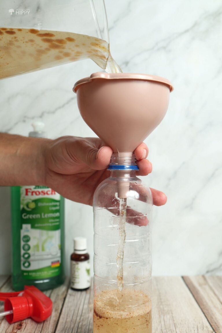 adding neem oil solution to sprayer