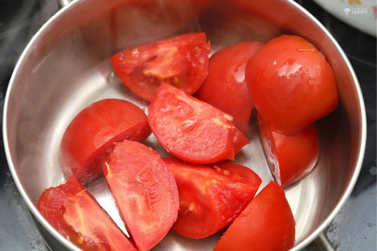 chopped tomatoes in saucepan chopped tomatoes in saucepan