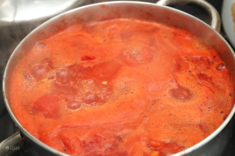 simmering tomatoes in saucepan