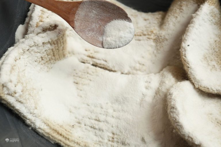 sprinkling baking soda over wool socks