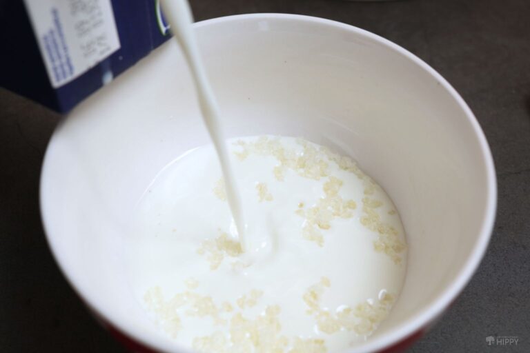 pouring milk over kefir grains